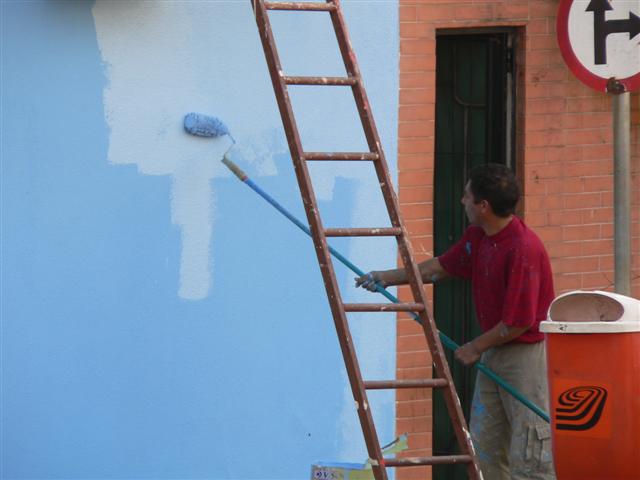 Man Painting Wall