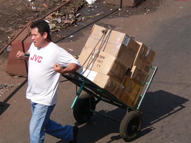 Man pulling hand trolley