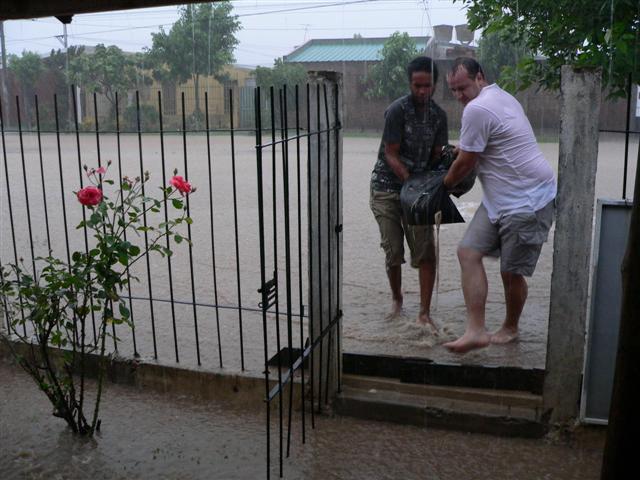 Men carrying a sandbag
