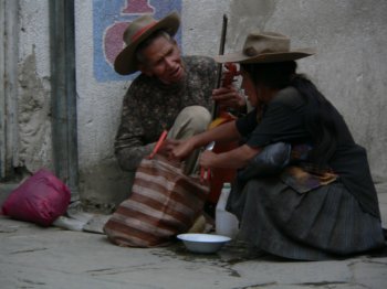 Fiddler and wife on street