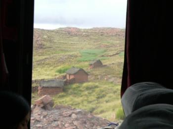 three houses seen through bus window