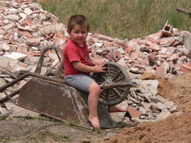 Boy on wheelbarrow