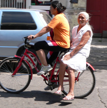 grandma on the back of a bike