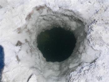 deep hole in salt surface