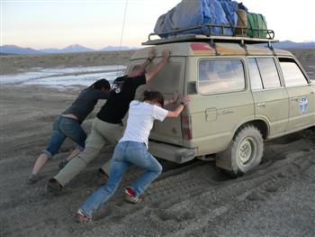pushing our stuck jeep