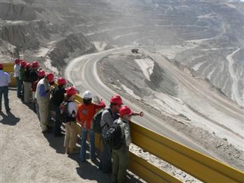 people looking into the pit