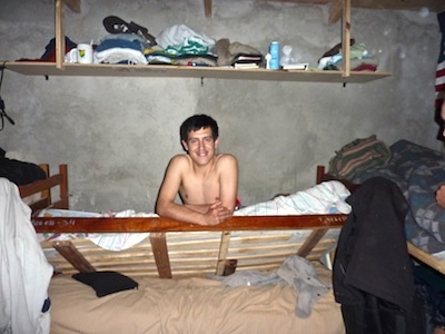 Miguel in his broken bed, still waking up.