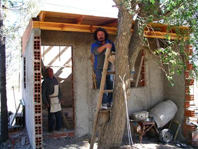 Putting the timber on for the roof.