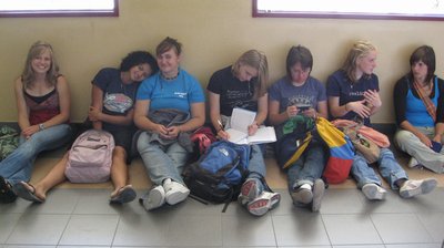Girls resting against the wall