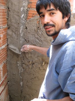 Fabian helping render the walls