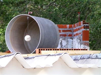 The water tank and beginnings of the wall behind it.