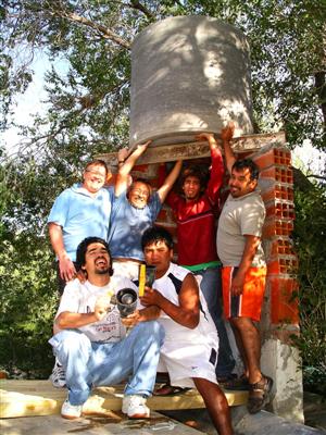 The team of guys needed to lift the tank.
